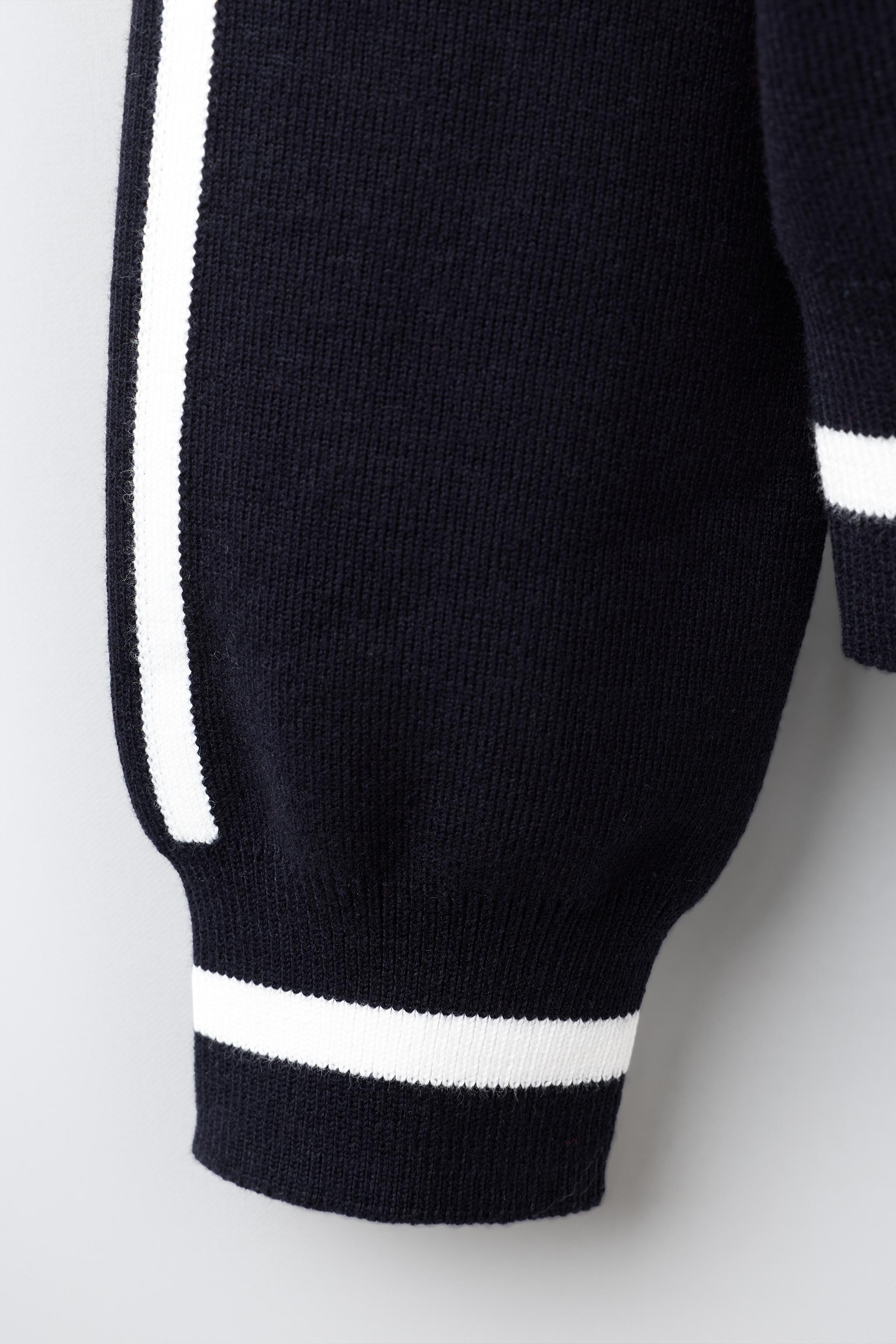 GILET EN MAILLE À LISERÉ CONTRASTÉ